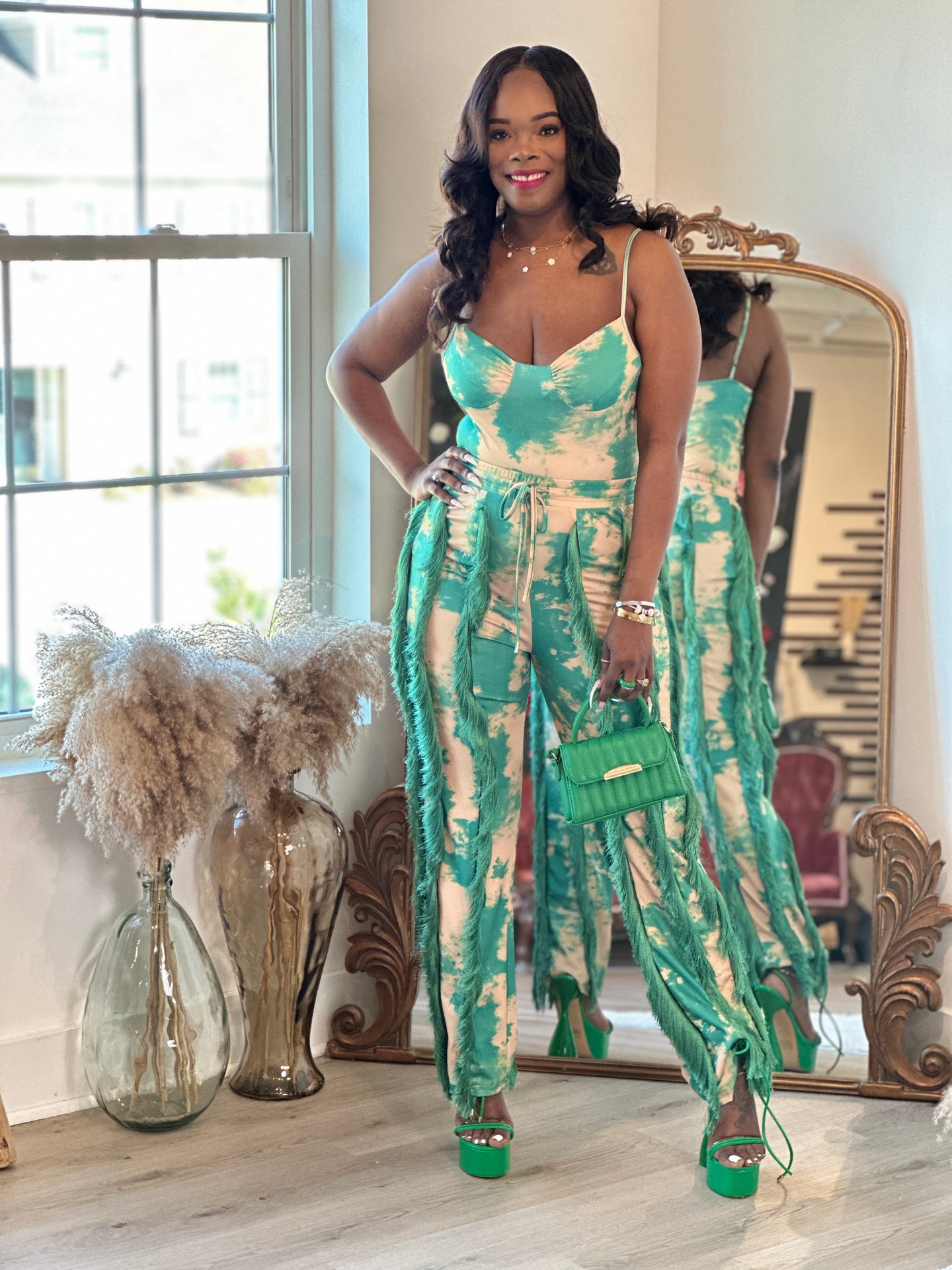 Plus size woman wearing green and cream tie-dye jumpsuit with wide legs and drawstring waist – Klassy Kurvez Kouture
